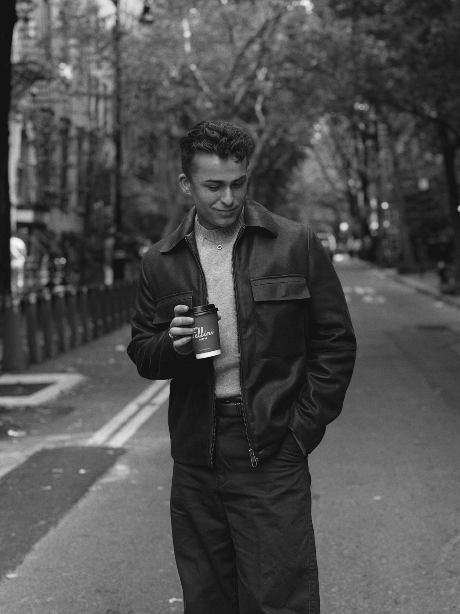 Samuel Cahoon, walking a New York street with a coffee